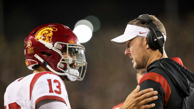USC Trojans quarterback Caleb Williams talks with USC Trojans head coach Lincoln Riley during the first half of the game against No. 6 Oregon Ducks on Saturday, Nov. 11, 2023, at Autzen Stadium in Eugene, Ore.